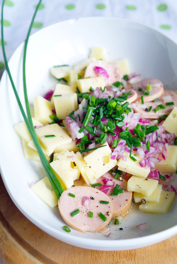 Swiss sausage salad with cervelat and mountain cheese